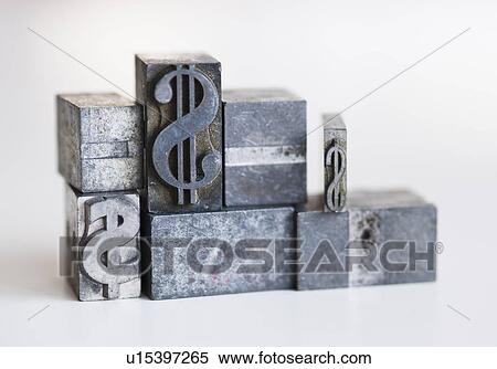 Stock Photography - Close up of printing blocks with dollar sign. Fotosearch