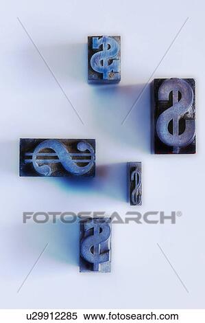 Stock Photography - Close up of printing blocks with dollar sign. Fotosearch