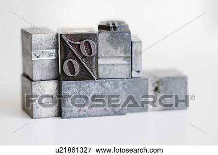 Stock Photo - Close up of printing blocks with percentage sign. Fotosearch