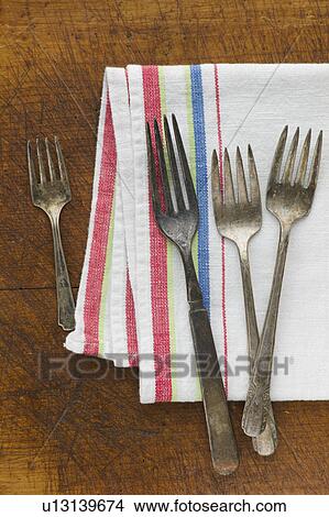 Close up of rusty silver forks and napkin View Large Photo Image Picture - Close up of rusty silver forks and napkin. Fotosearch