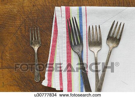 Close up of rusty silver forks and napkin View Large Photo Image Picture - Close up of rusty silver forks and napkin. Fotosearch