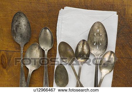 Close up of rusty silver spoons and napkin View Large Photo Image Stock Photo - Close up of rusty silver spoons and napkin. Fotosearch