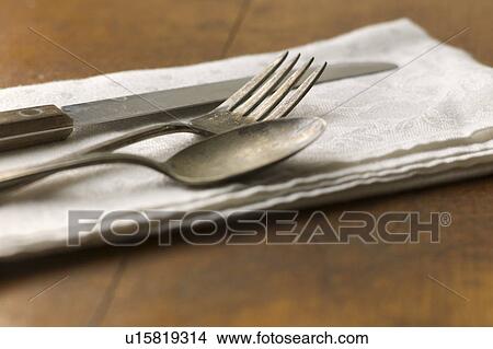 Close up of silver forks, knife and spoon on napkin View Large Photo Image Picture - Close up of silver forks, knife and spoon on napkin. Fotosearch