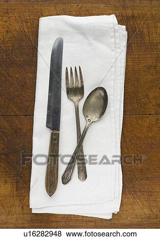 Close up of silver forks, knife and spoon on napkin View Large Photo Image Stock Photo - Close up of silver forks, knife and spoon on napkin. Fotosearch