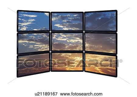 Stock Photo - Close up of sky at sunset on monitors. Fotosearch