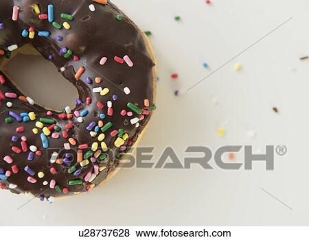 Stock Photo - Close-up of sprinkled donut. Fotosearch