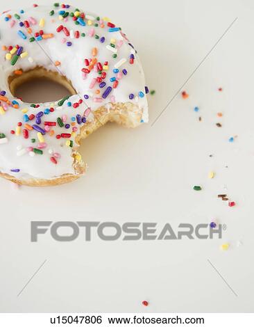 Stock Photograph - Close-up of sprinkled donut. Fotosearch