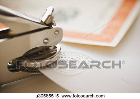 Close up of stamper making seal on paper View Large Photo Image Stock Photography - Close up of stamper making seal on paper. Fotosearch