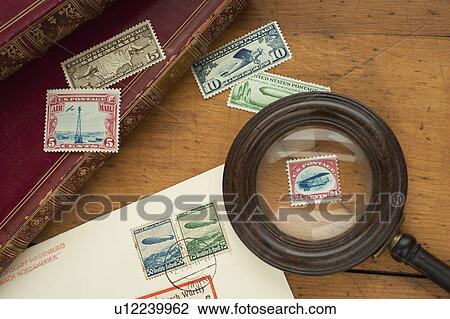 Close up of stamps collection and magnifying glass View Large Photo Image Stock Image - Close up of stamps collection and magnifying glass. Fotosearch
