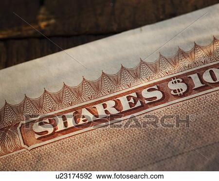 Stock Image - Close up of stock certificate. Fotosearch