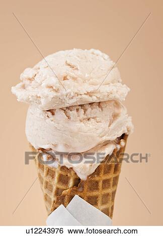 Stock Photograph - Close up of vanilla ice cream cone. Fotosearch
