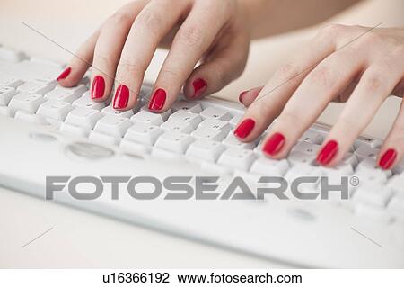 Close up of woman's fingers with red nail polish typing on computer keyboard View Large Photo Image Stock Image - Close up of woman's fingers with red nail polish typing on computer keyboard. Fotosearch