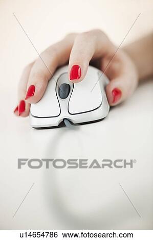 Close up of woman's hand with red nail polish holding computer mouse View Large Photo Image Stock Photograph - Close up of woman's hand with red nail polish holding computer mouse. Fotosearch