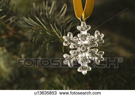 Close-up view of silver star hanging on Christmas tree View Large Photo Image Stock Image - Close-up view of silver star hanging on Christmas tree. Fotosearch