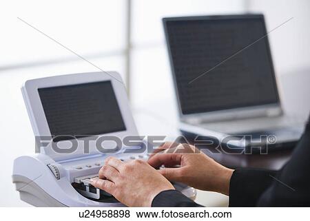 Court stenographer using stenograph machine View Large Photo Image Stock Photo - Court stenographer using stenograph machine. Fotosearch
