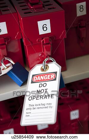 Stock Photo - Danger tag on lock. Fotosearch