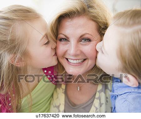 Daughters (8-11) kissing mother View Large Photo Image Stock Image - Daughters (8-11) kissing mother. Fotosearch