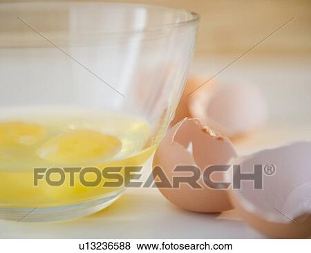 Egg yolks in bowl and egg shell on side View Large Photo Image Stock Photo - Egg yolks in bowl and egg shell on side. Fotosearch