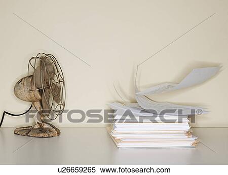 Electric fan blowing on heap of papers View Large Photo Image Stock Photography - Electric fan blowing on heap of papers. Fotosearch