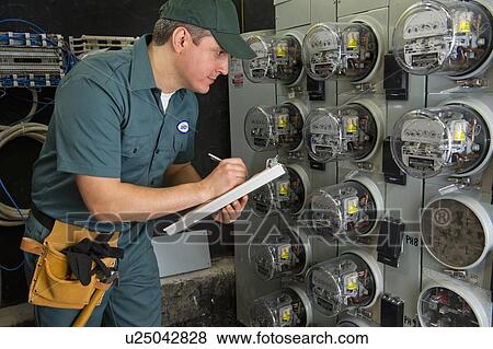 Electrician controlling electric meters View Large Photo Image Stock Photo - Electrician controlling electric meters. Fotosearch
