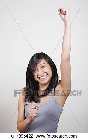 Stock Image - Enthusiastic young woman. Fotosearch