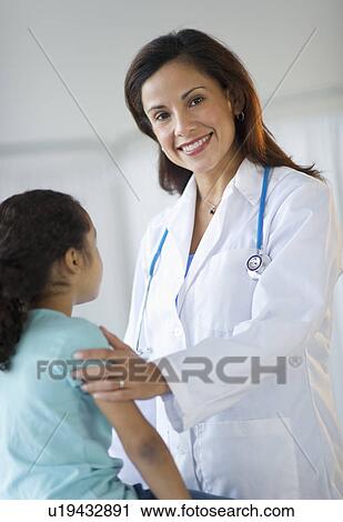 Female pediatrician examining girl (6-7) in doctor's office View Large Photo Image Stock Image - Female pediatrician examining girl (6-7) in doctor's office. Fotosearch