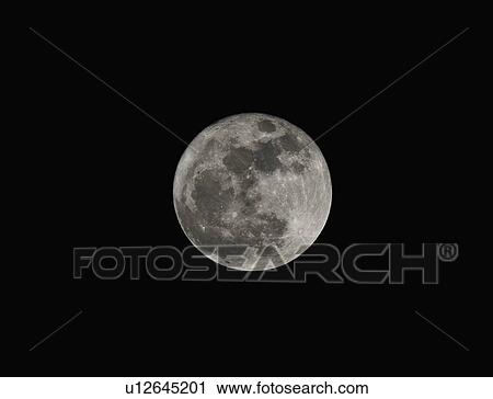 Stock Image - Full moon against night sky. Fotosearch