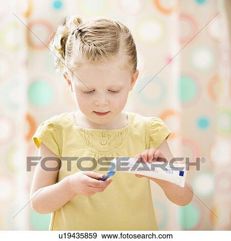 Stock Photo - Girl (2-3) brushing teeth. Fotosearch