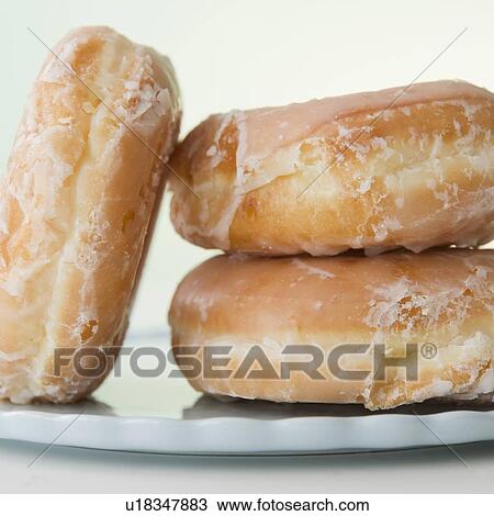 Glazed donuts, close-up View Large Photo Image Stock Image - Glazed donuts, close-up. Fotosearch