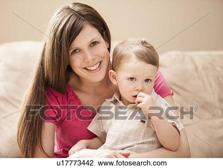 Gortrait of mother with son (2-3) on sofa View Large Photo Image Stock Image - Gortrait of mother with son (2-3) on sofa. Fotosearch