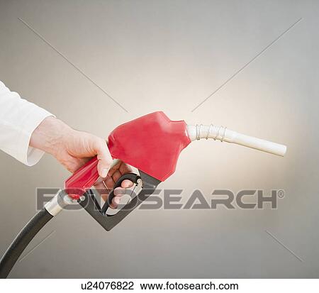 Hand holding fuel pump View Large Photo Image Stock Image - Hand holding fuel pump. Fotosearch