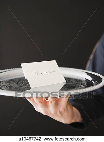 Stock Image - Hand holding tray with envelope. Fotosearch