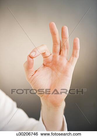 Hand showing okay sign View Large Photo Image Stock Photograph - Hand showing okay sign. Fotosearch