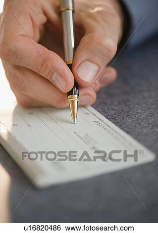 Hand signing check View Large Photo Image Stock Photograph - Hand signing check. Fotosearch