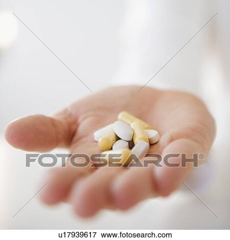 Stock Photo - Handful of pills. Fotosearch