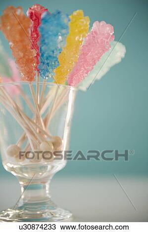 Stock Image - Hard rock candies in glass. Fotosearch