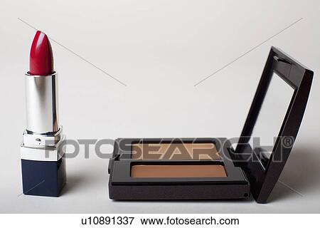Stock Photo - Make-up kit with red lipstick. Fotosearch