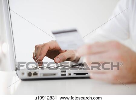 Man shopping online, close-up of hands View Large Photo Image Stock Image - Man shopping online, close-up of hands. Fotosearch