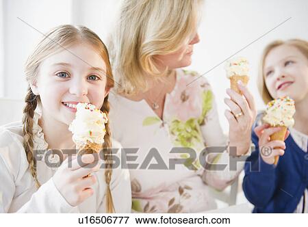 Mother and daughter (8-11) eating ice cream View Large Photo Image Stock Photo - Mother and daughter (8-11) eating ice cream. Fotosearch