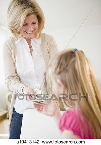 Mother giving daughter (10-11) money View Large Photo Image Stock Image - Mother giving daughter (10-11) money. Fotosearch