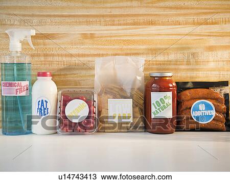 Stock Image - Organic products in row at shelf. Fotosearch
