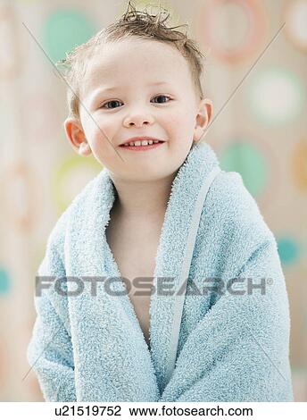 Stock Image - Portrait of boy (2-3) wrapped in towel. Fotosearch