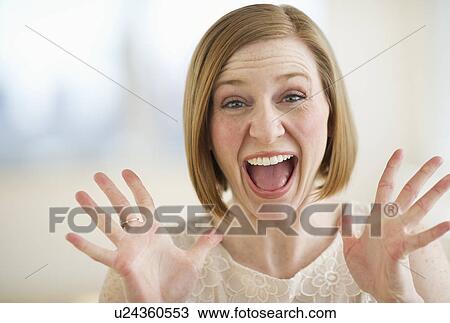 Portrait of excited woman screaming View Large Photo Image Stock Image - Portrait of excited woman screaming. Fotosearch
