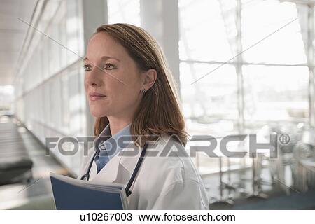 Stock Image - Portrait of female doctor. Fotosearch