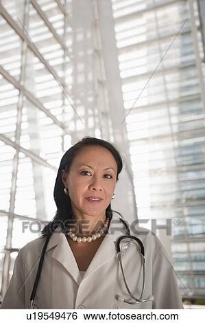 Portrait of female doctor View Large Photo Image Stock Photograph - Portrait of female doctor. Fotosearch