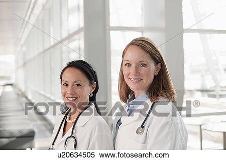 Portrait of female doctors View Large Photo Image Stock Photography - Portrait of female doctors. Fotosearch