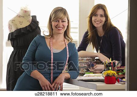 Portrait of female fashion designers in studio View Large Photo Image Stock Image - Portrait of female fashion designers in studio. Fotosearch