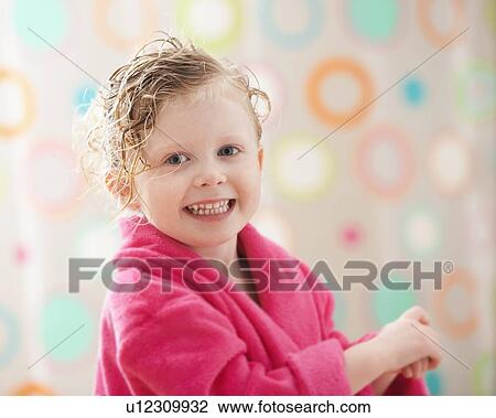 Stock Image - Portrait of girl (2-3) wrapped in bathrobe. Fotosearch