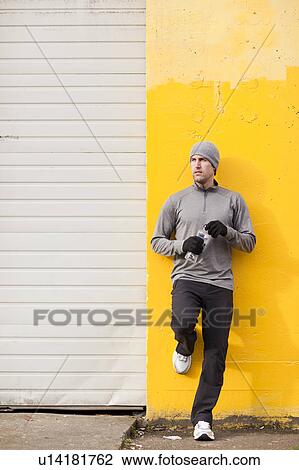 Stock Image - Portrait of man in workout wear. Fotosearch