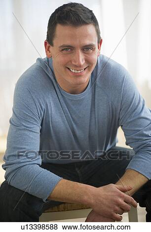 Stock Photo - Portrait of mid adult man smiling. Fotosearch